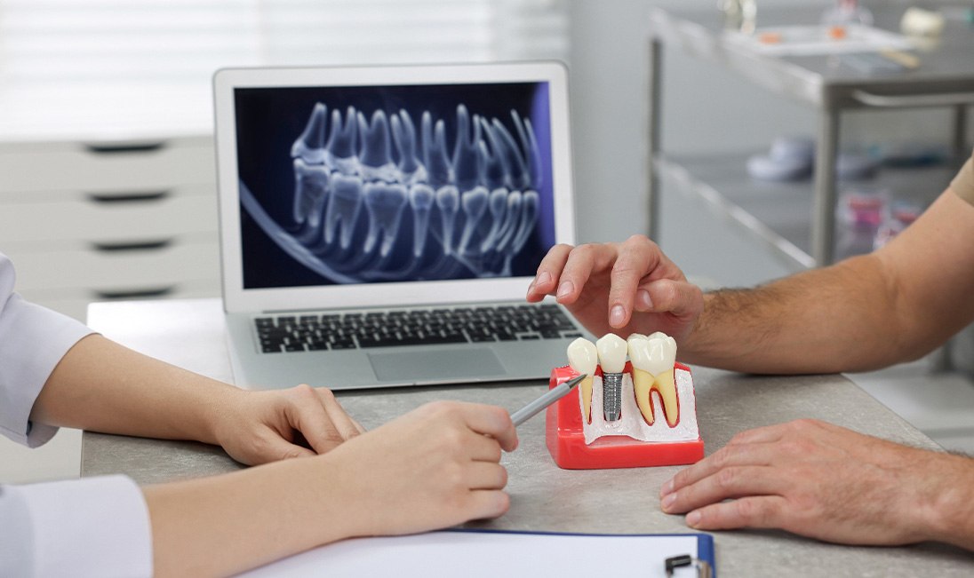 Dentist discussing treatment