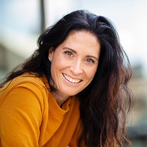 a smiling woman with dark hair