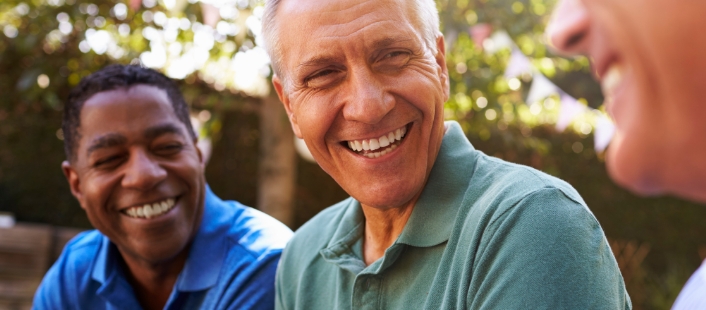 Group of men laughing together outdoors