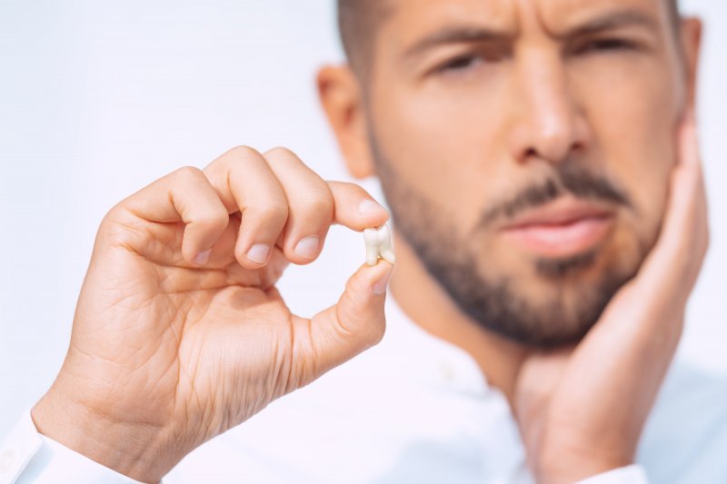 A man who just got an extraction to try to cure his gum disease